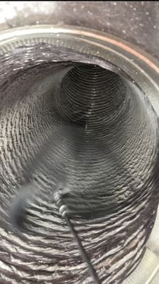 Technician inspecting ductwork